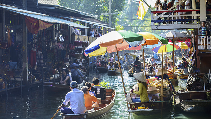 Busy floating market lined with vendor boats