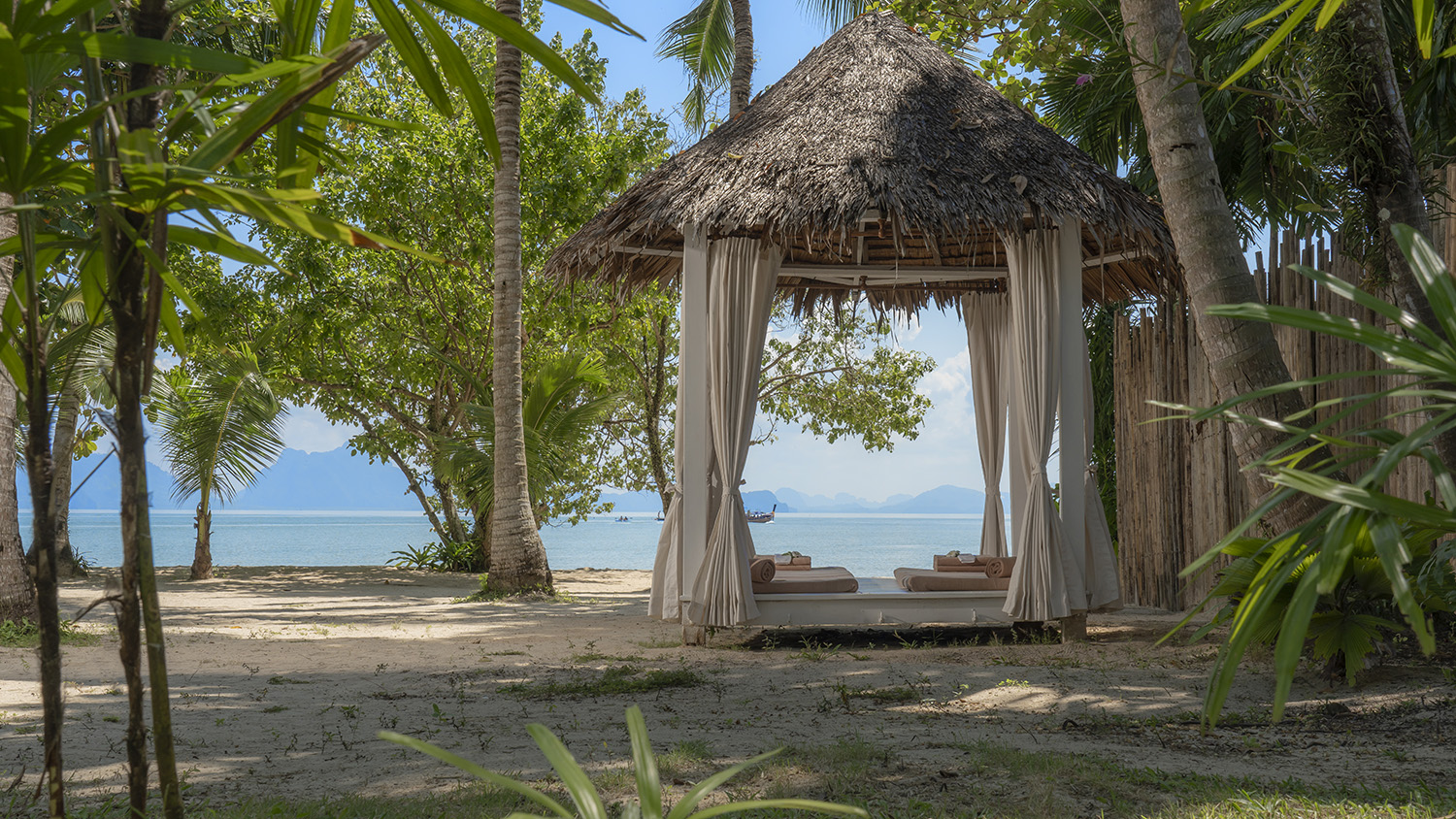 Curtained beachfront massage pavilion looking out to Phang Nga Bay